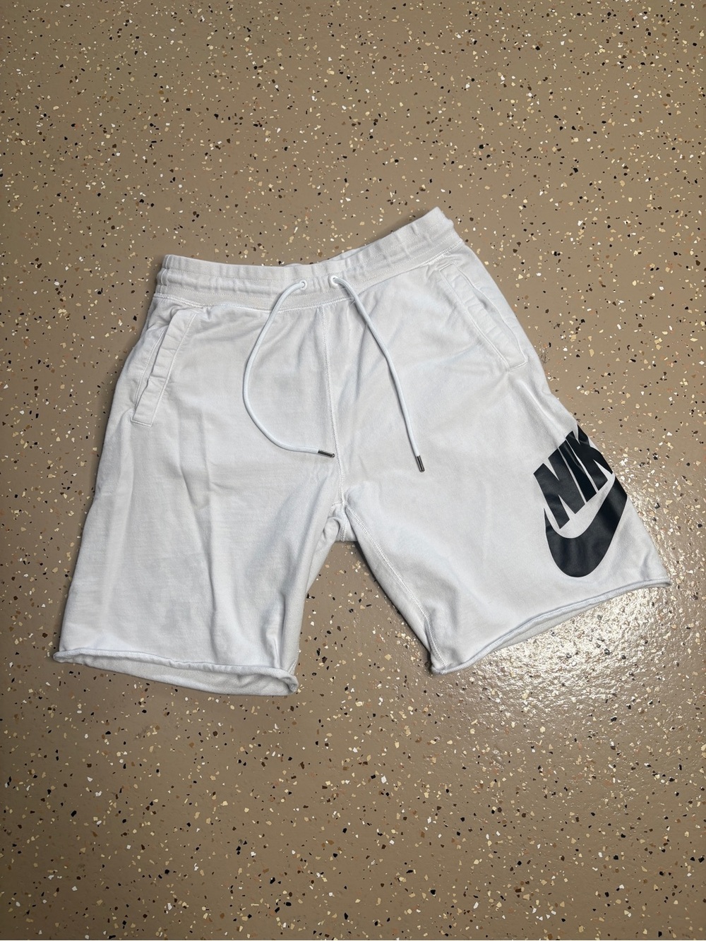 Nike Men’s White Athletic Shorts with Black Logo